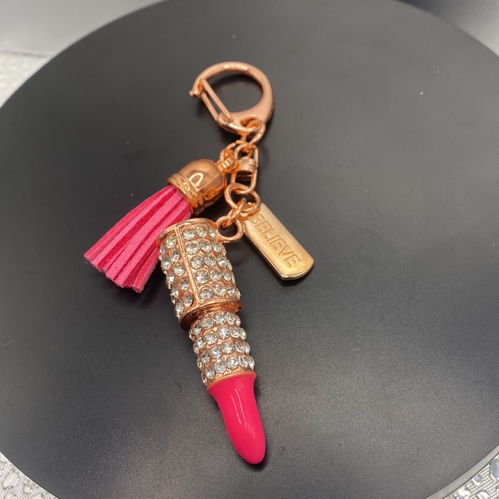 Rose gold tone keychain hot pink lipstick with crystals with believe on tag